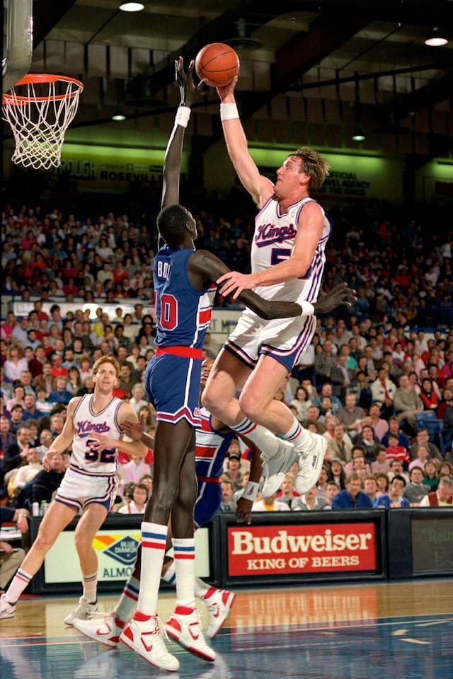 Manote Bol #10 of the Washington Bullets blocks a shot attempt by Mark Olberding #53 of the Sacramento Kings during a game played on February 14, 1987 at Arco Arena in Sacramento, California.